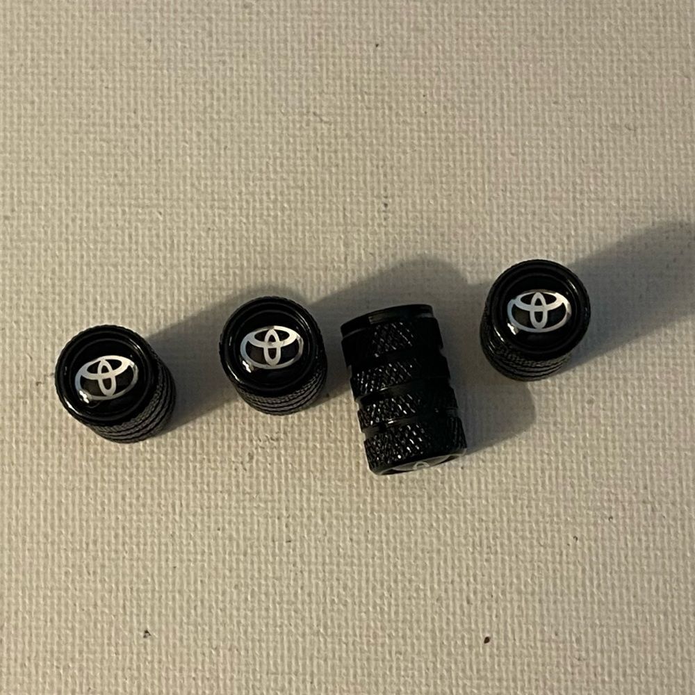 Toyota Logo valve Stem caps in black set of 4 NWT